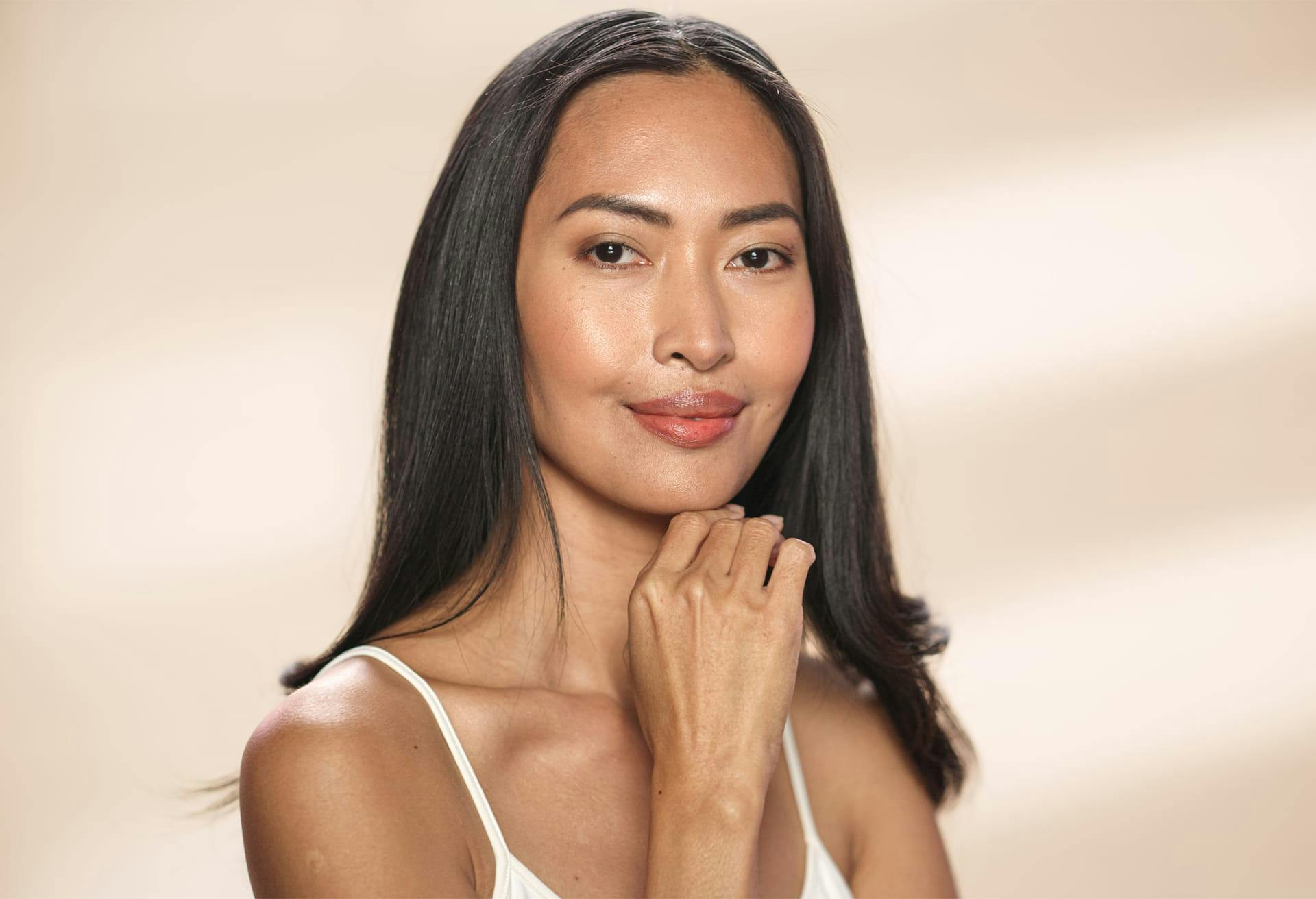 Woman with her hand on her chin