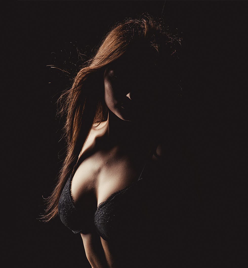 woman in a bra top posing for a picture