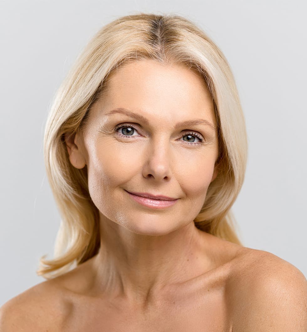 blond woman with blue eyes and no shirt posing for a picture