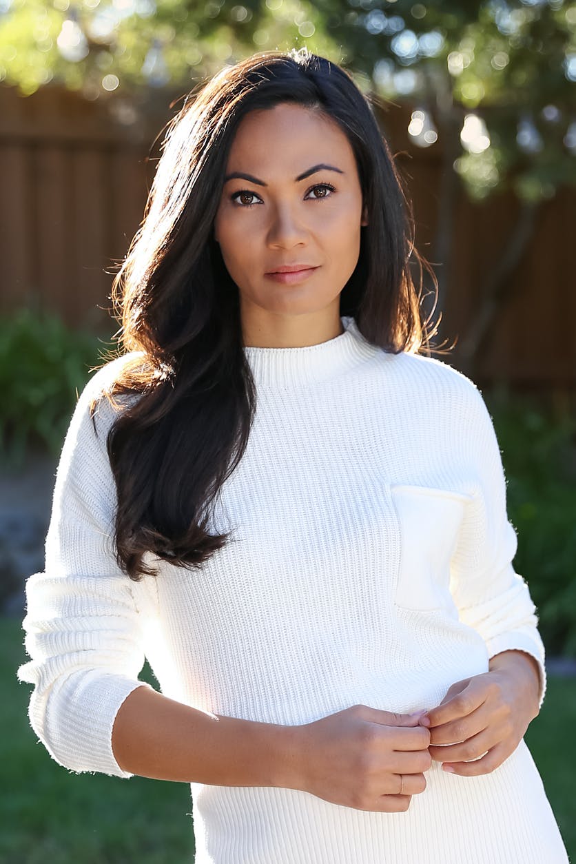 Woman wearing a white sweater outside