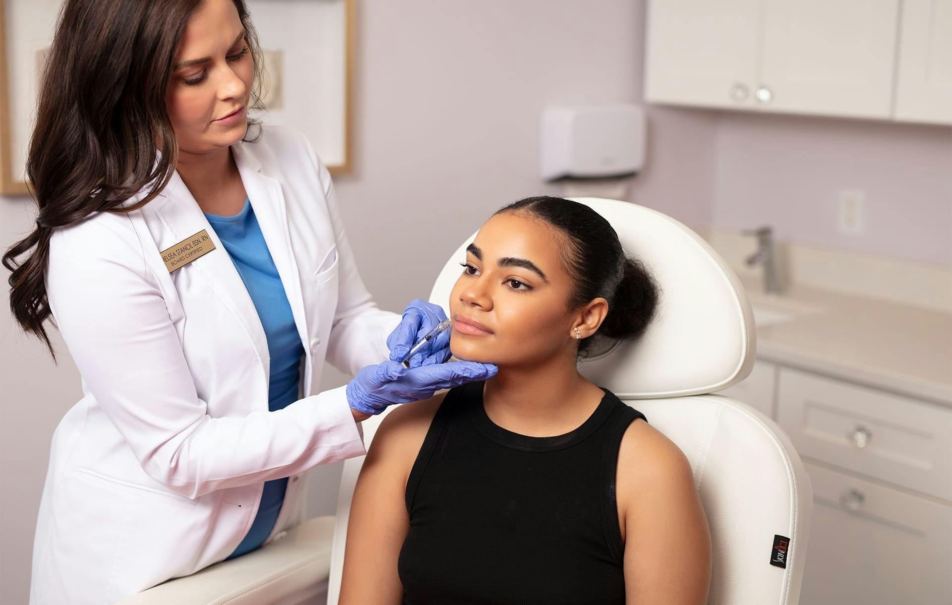 doctor touching patient's face
