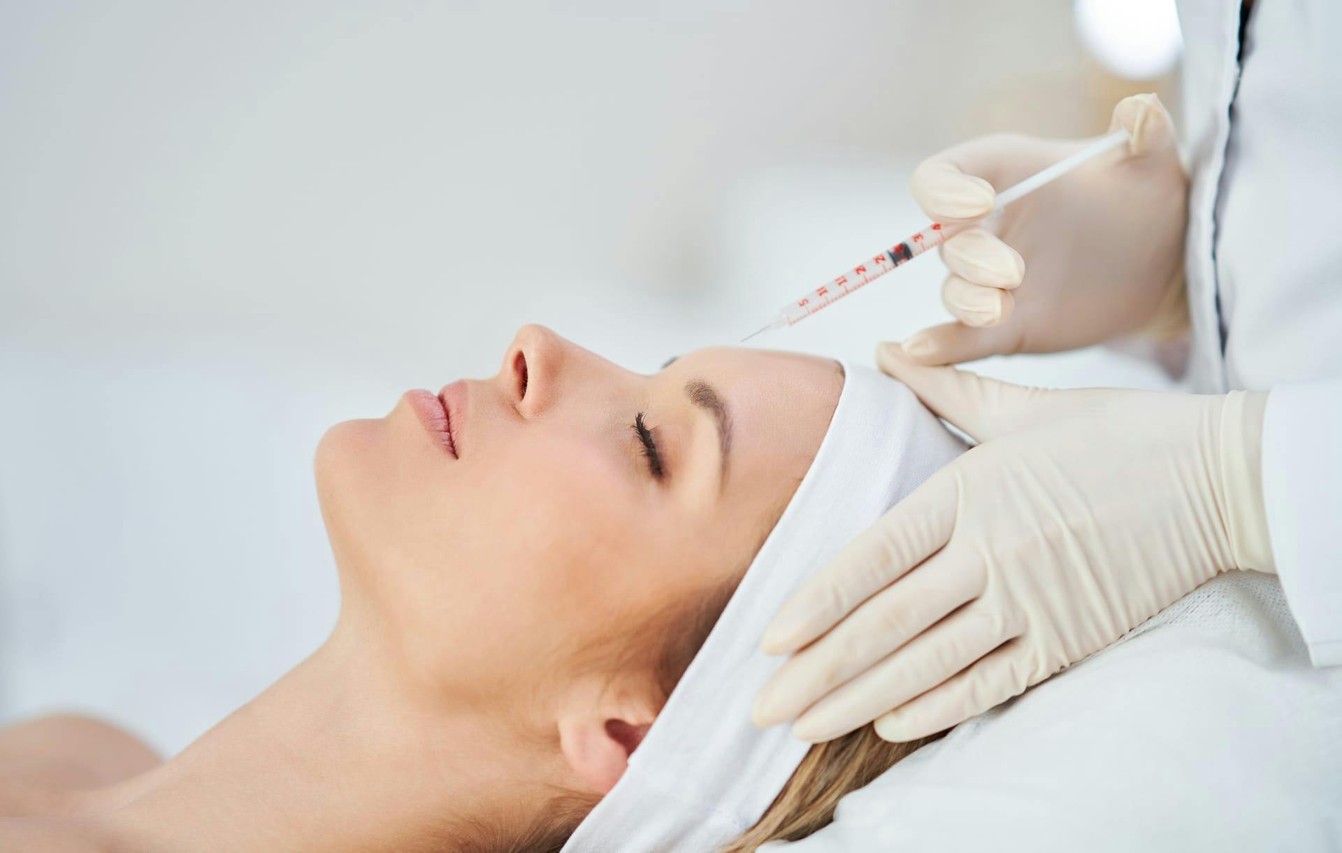 patient getting an injection on her forehead