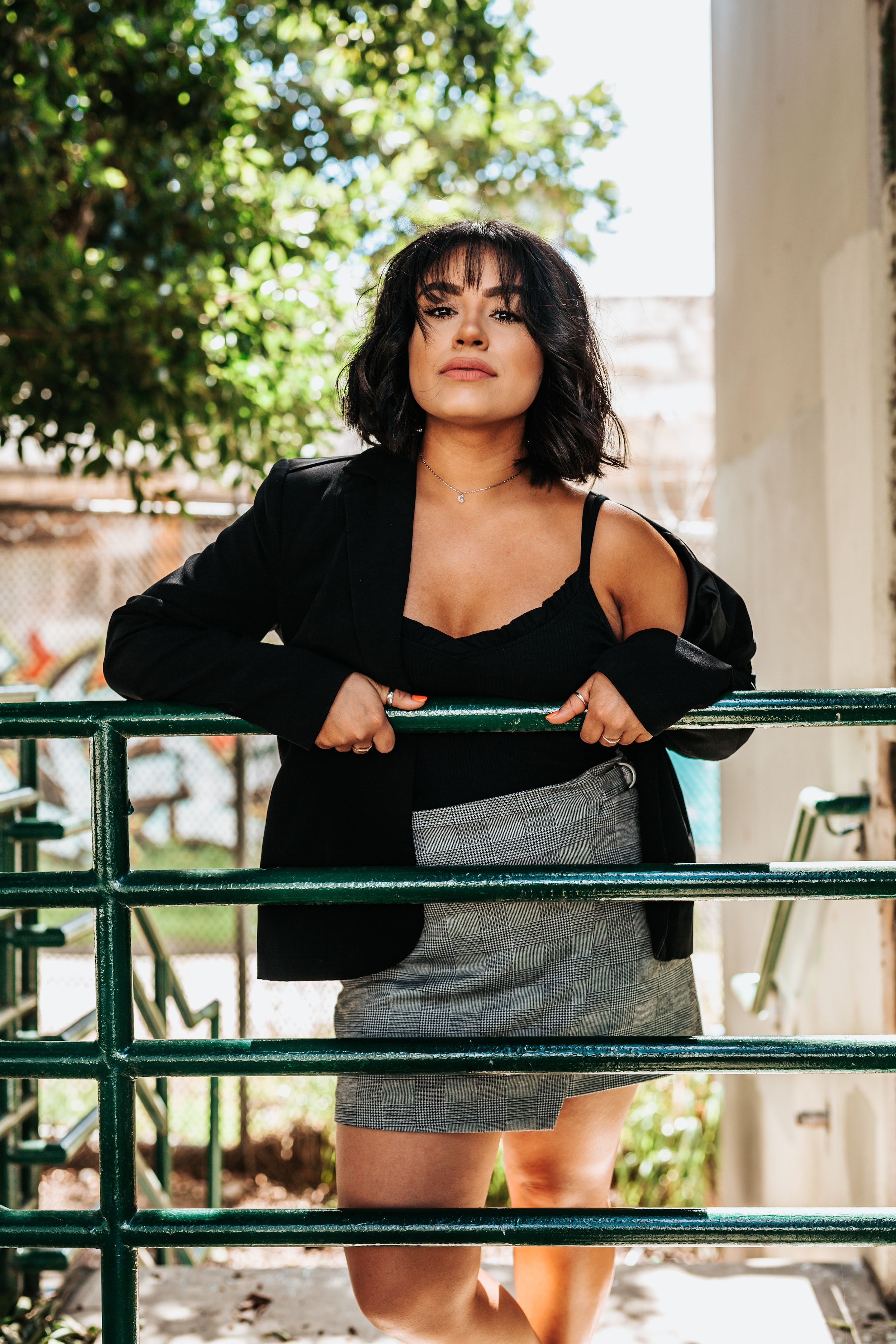 woman leaning on fence