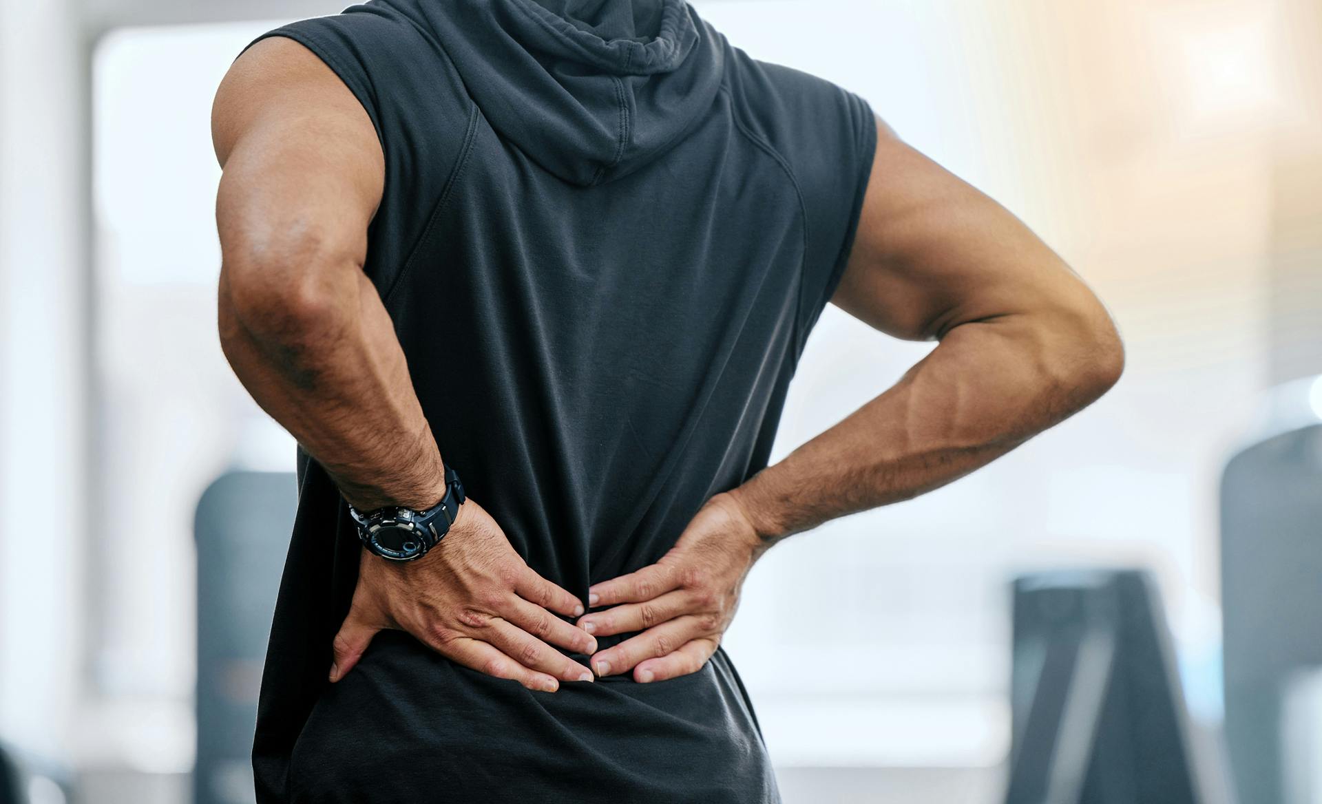 man holding painful back