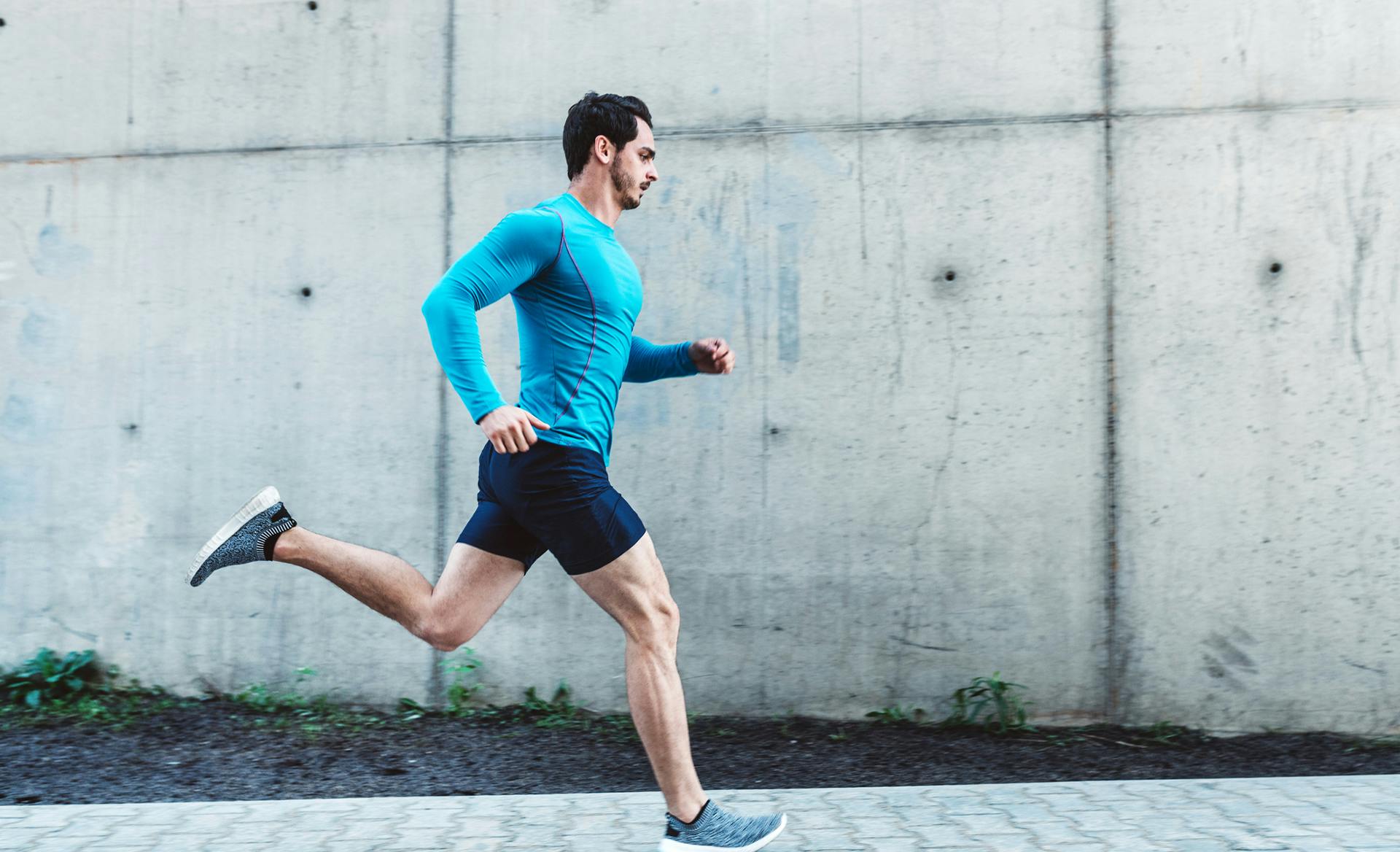 man running in blue shirt