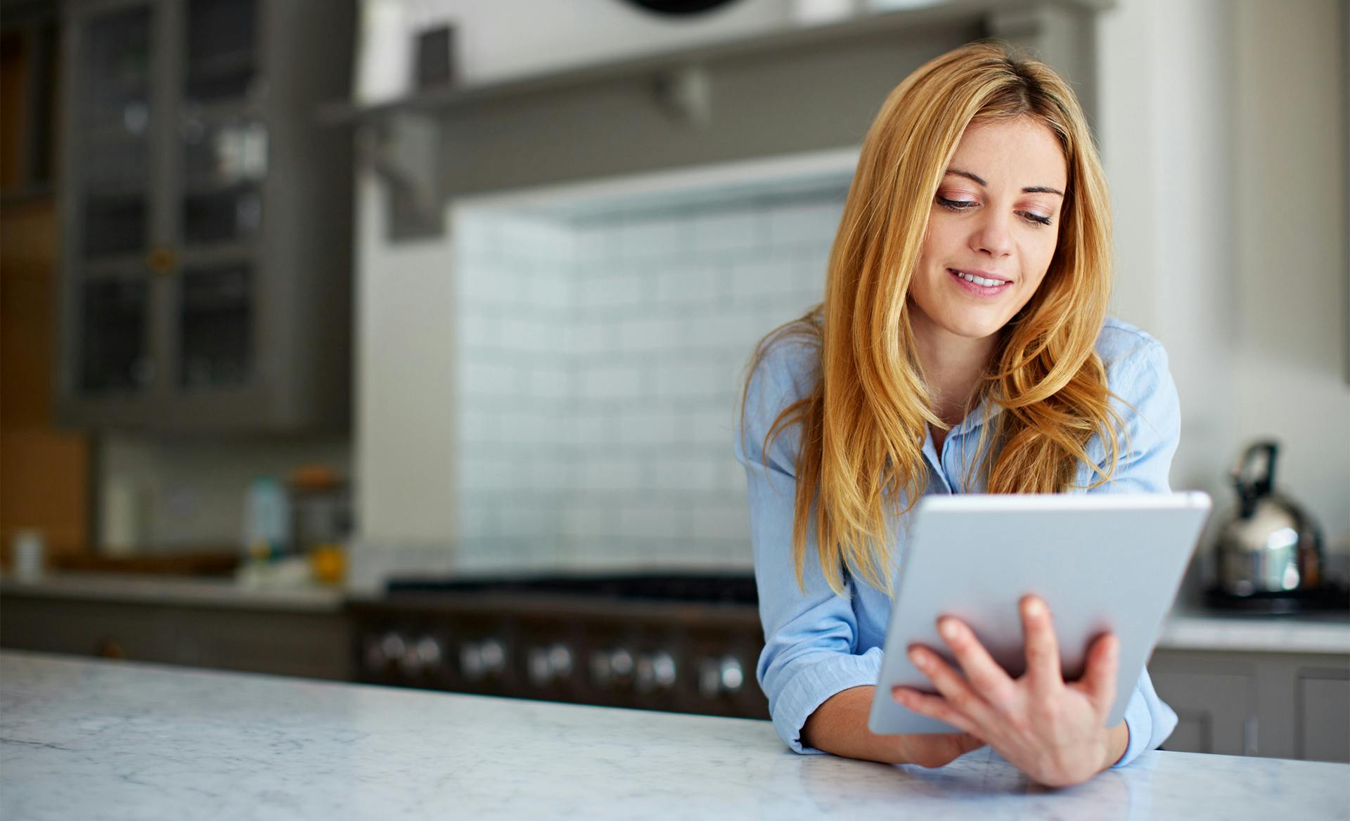 woman checking tablet