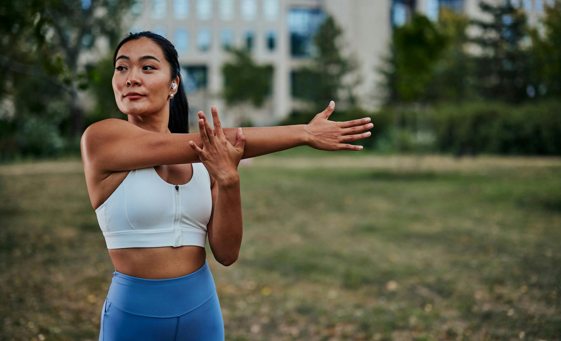 woman stretching arm