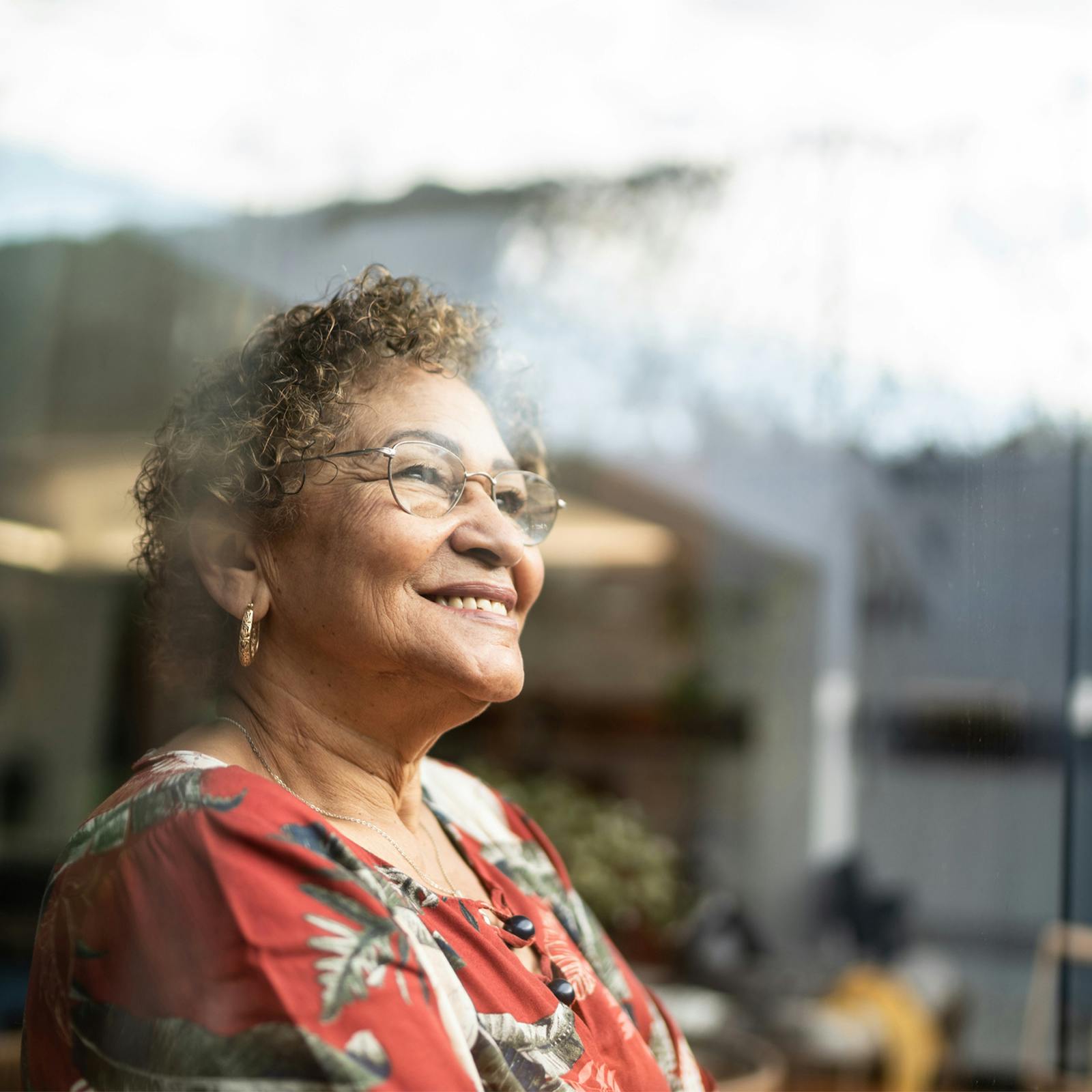 woman happily looking out window