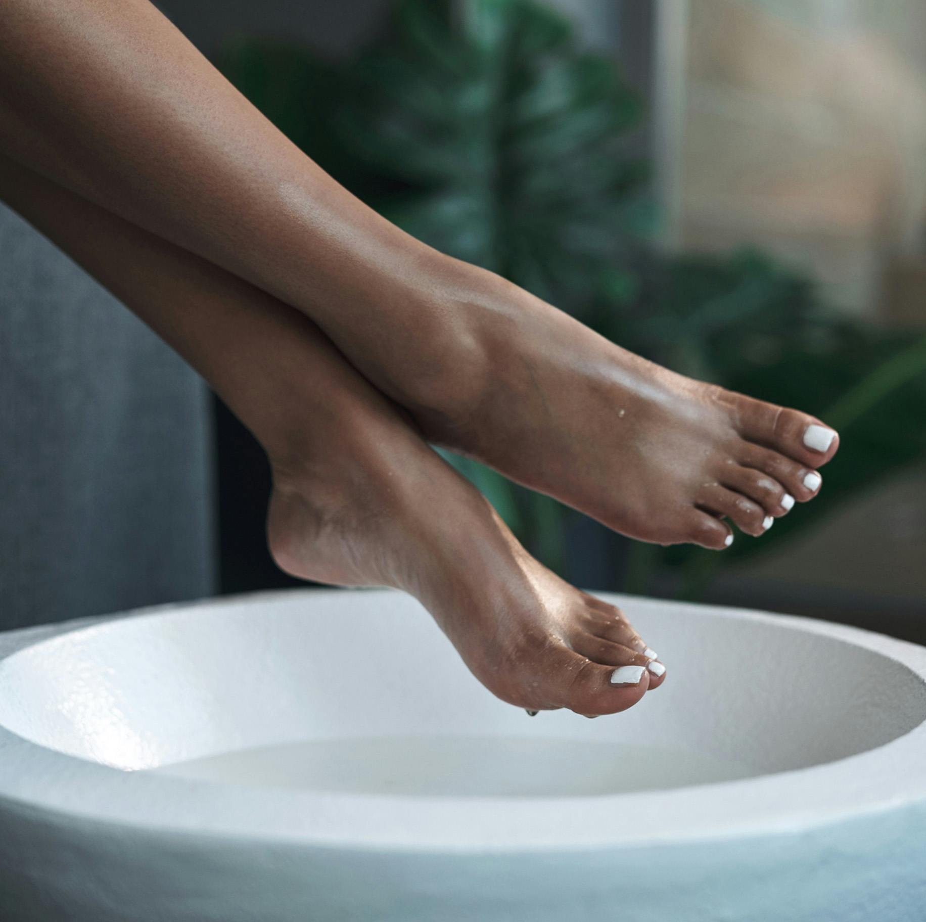 womans feet over bowl