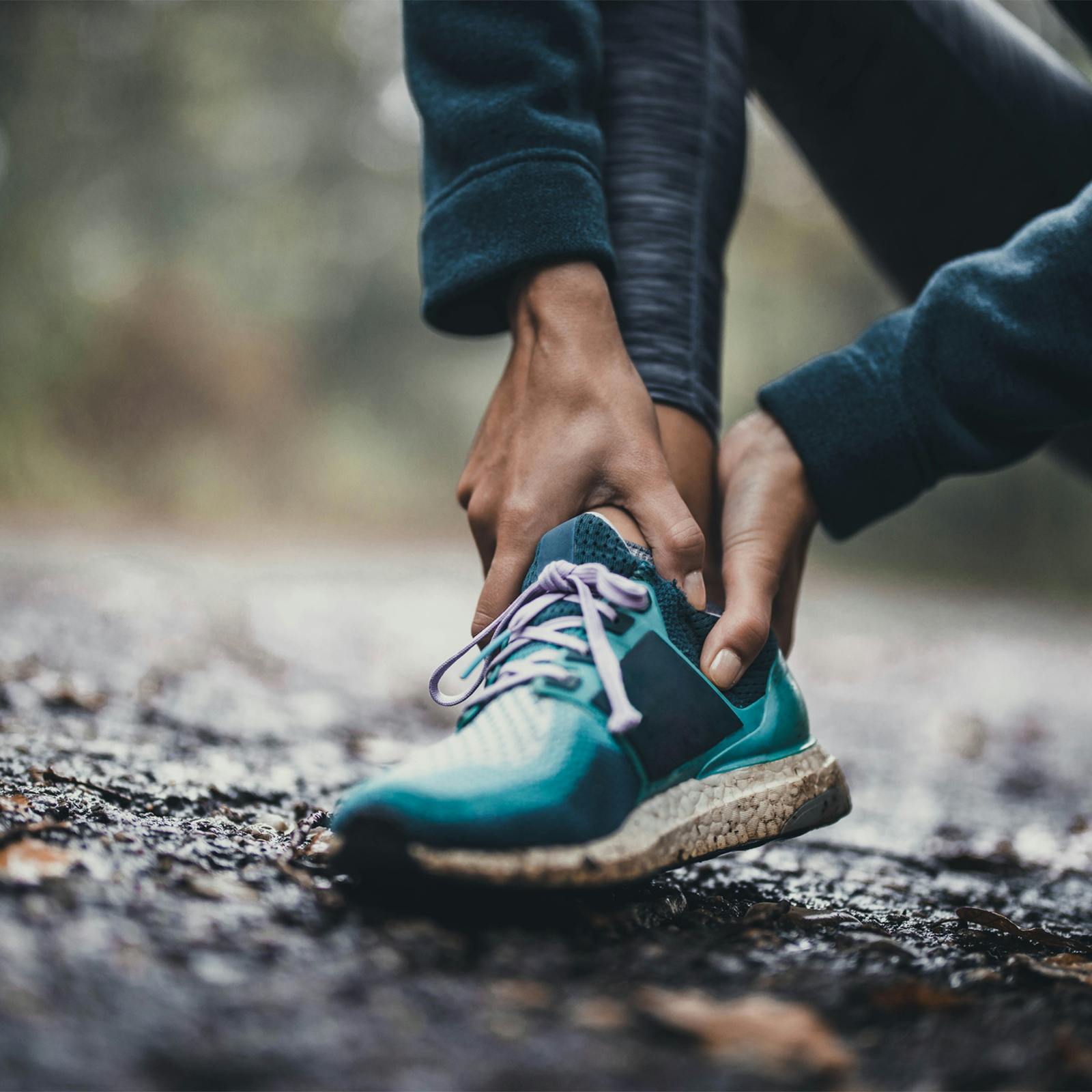 person holding ankle