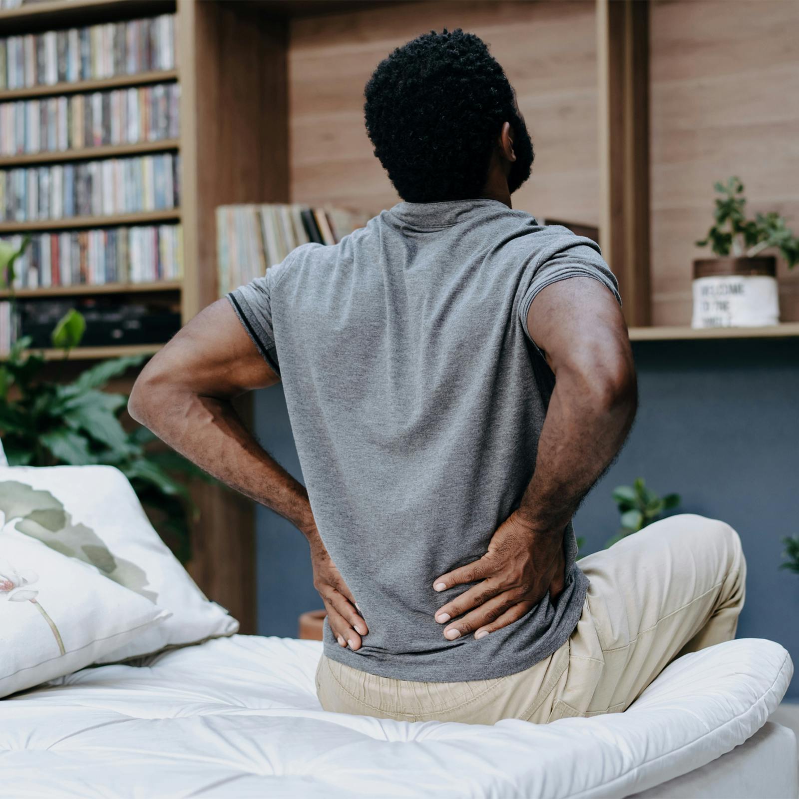 man holding painful back