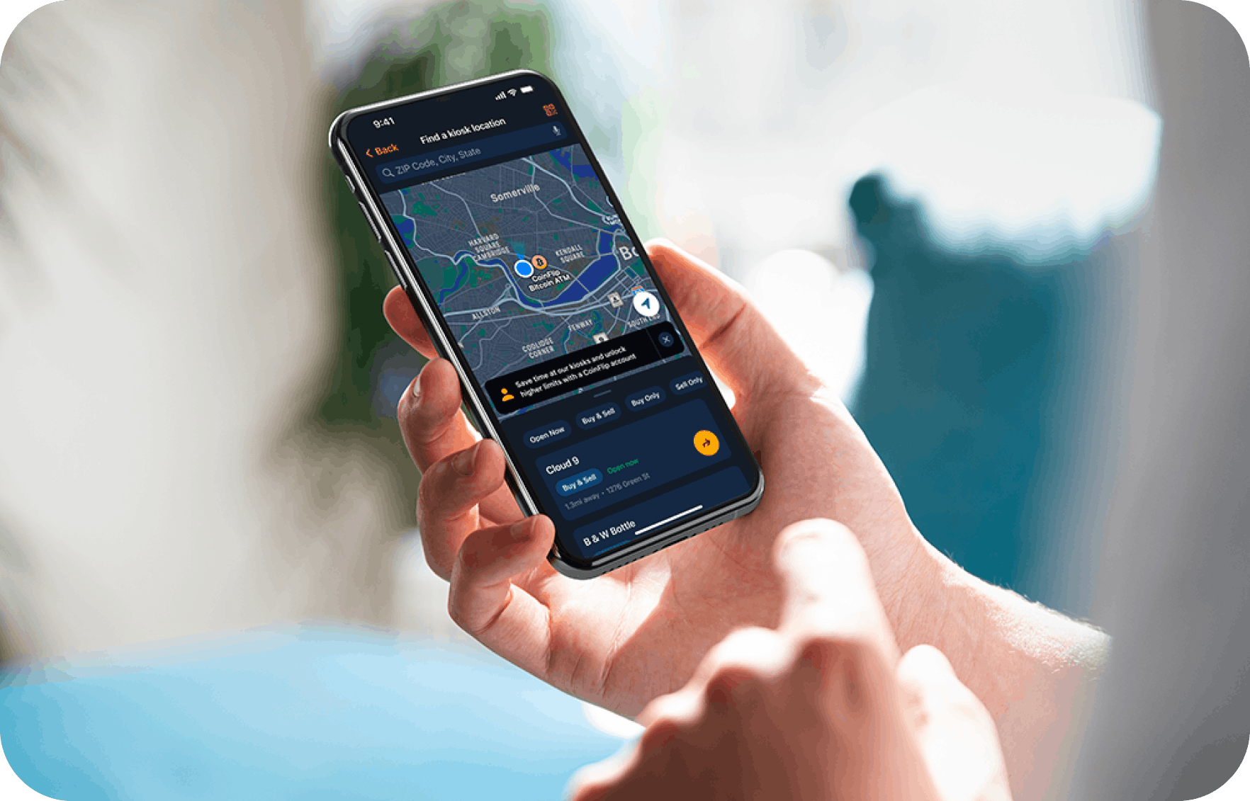 Hand holding phone with CoinFlip wallet open