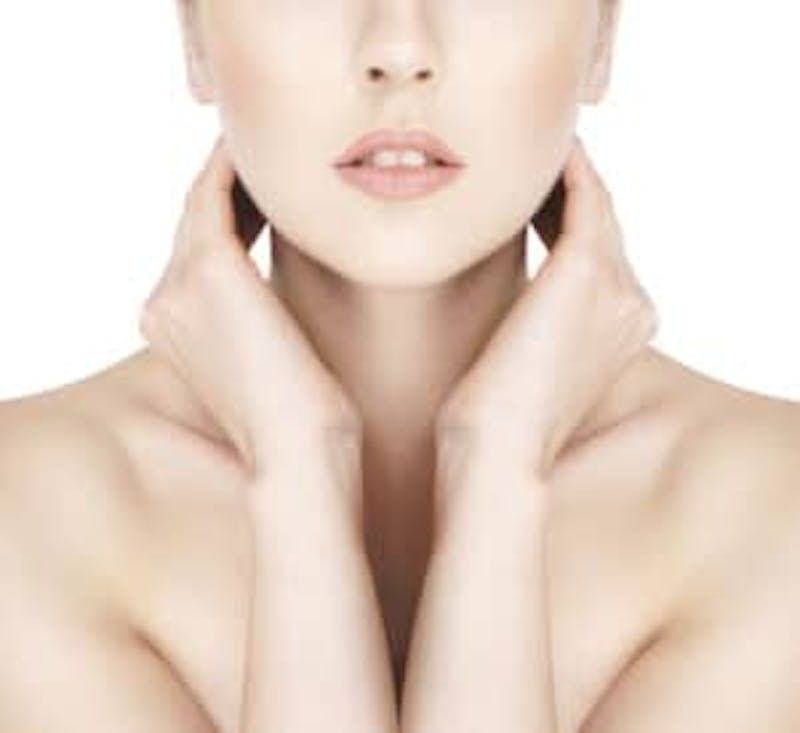 woman with her hands near her neck