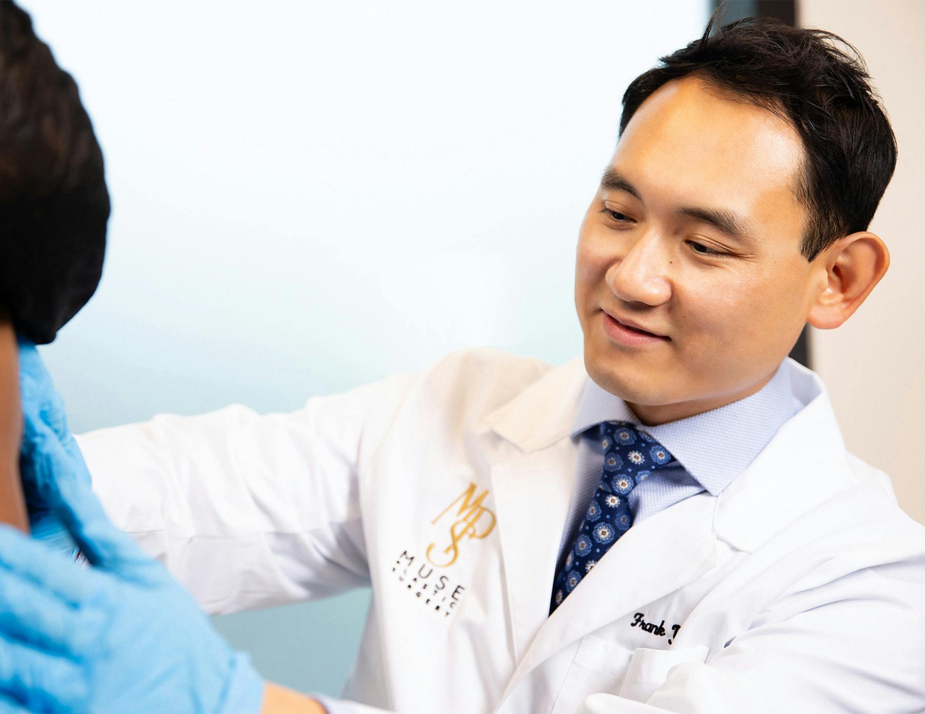 doctor checking patient