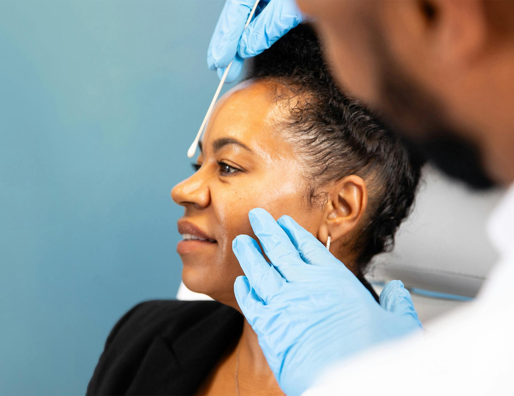 doctor demonstrating procedure on patient