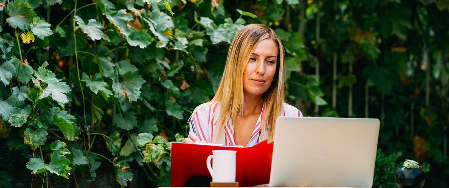 Woman with laptop and coffee