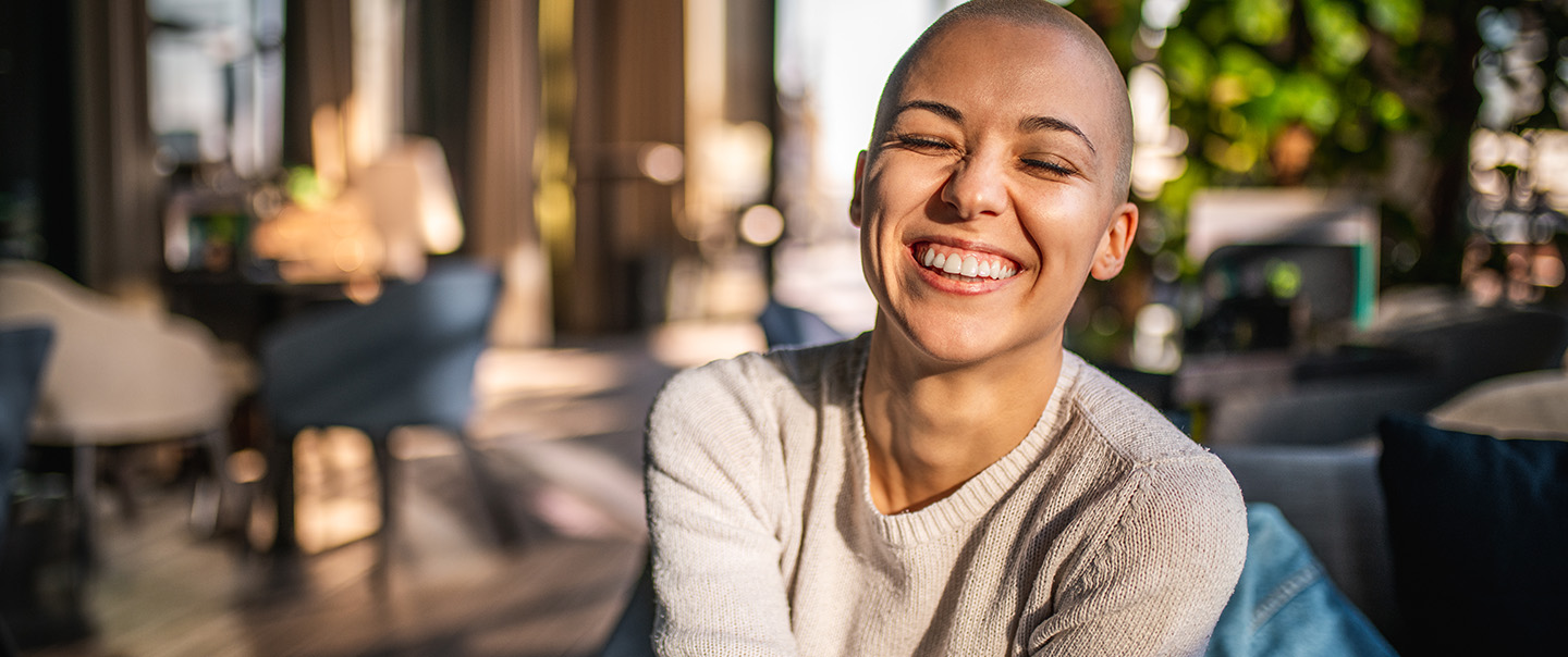 Smiling short-haired woman in living room