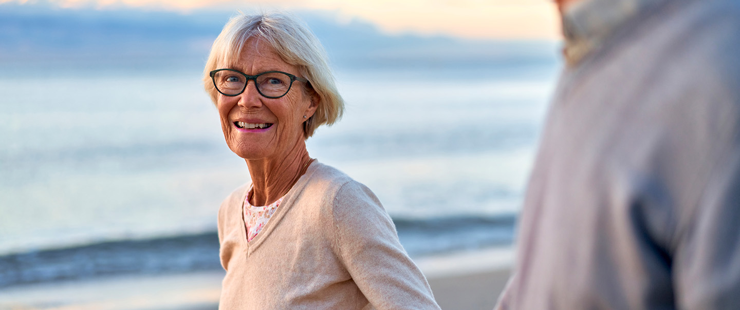 Woman with glasses on the beach