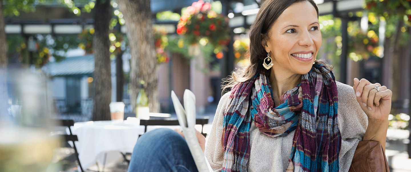Woman with colourful scarf at cafe