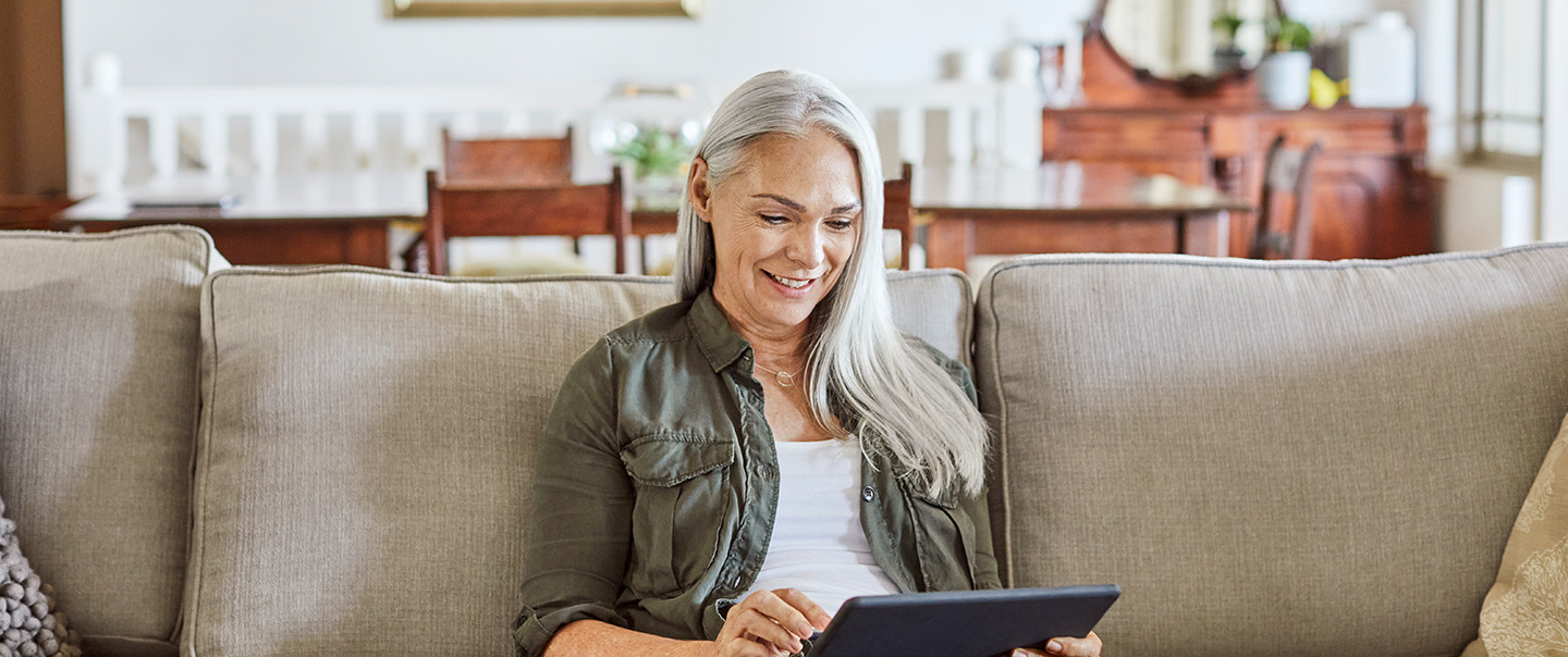 Woman on couch with iPad