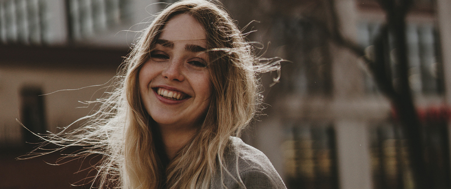 Young woman with wind-blown hair