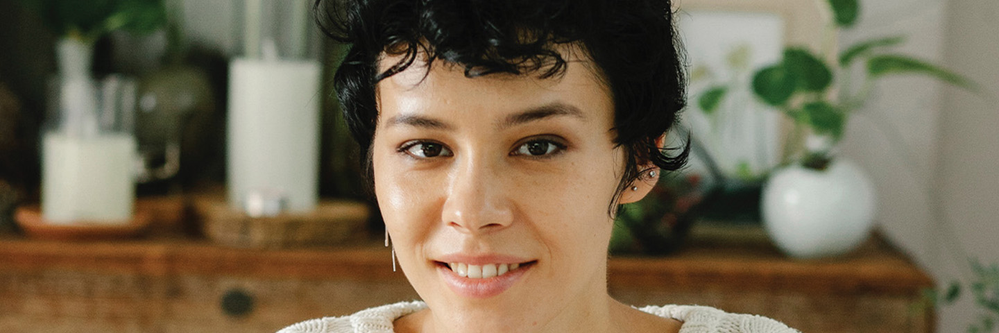 Woman with white jumper in lounge room