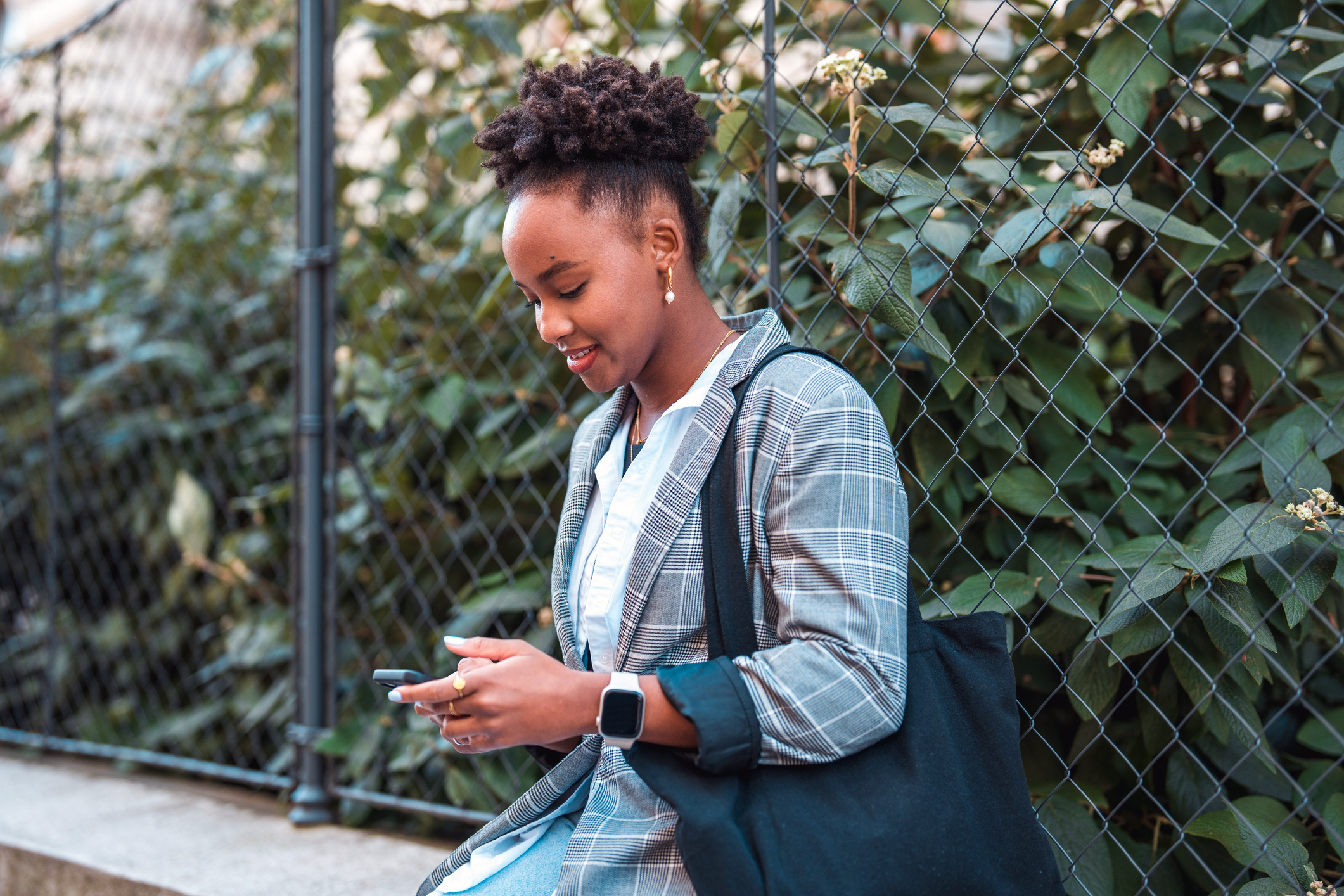 Woman at a park looking at her phone