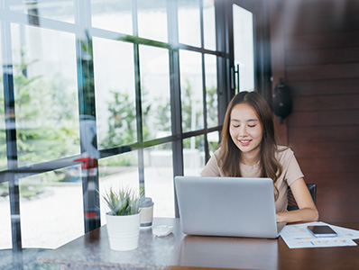 Woman at a laptop doing work