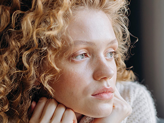 Woman looking out window