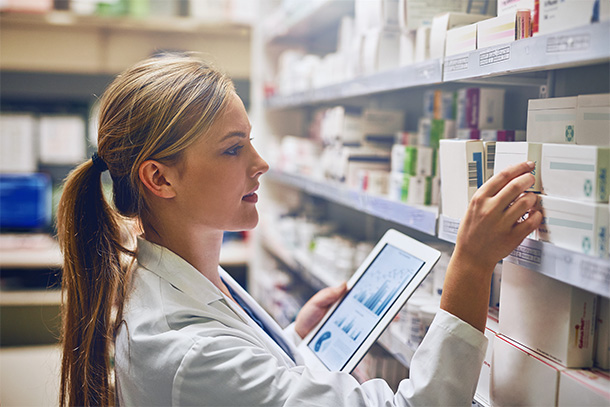 Pharmacist selecting medication