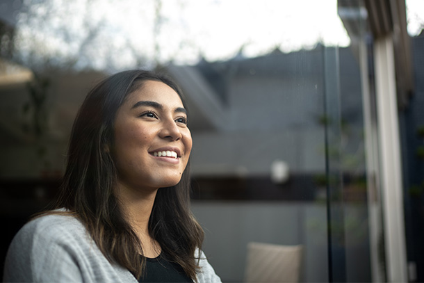 Woman happily looking out the window