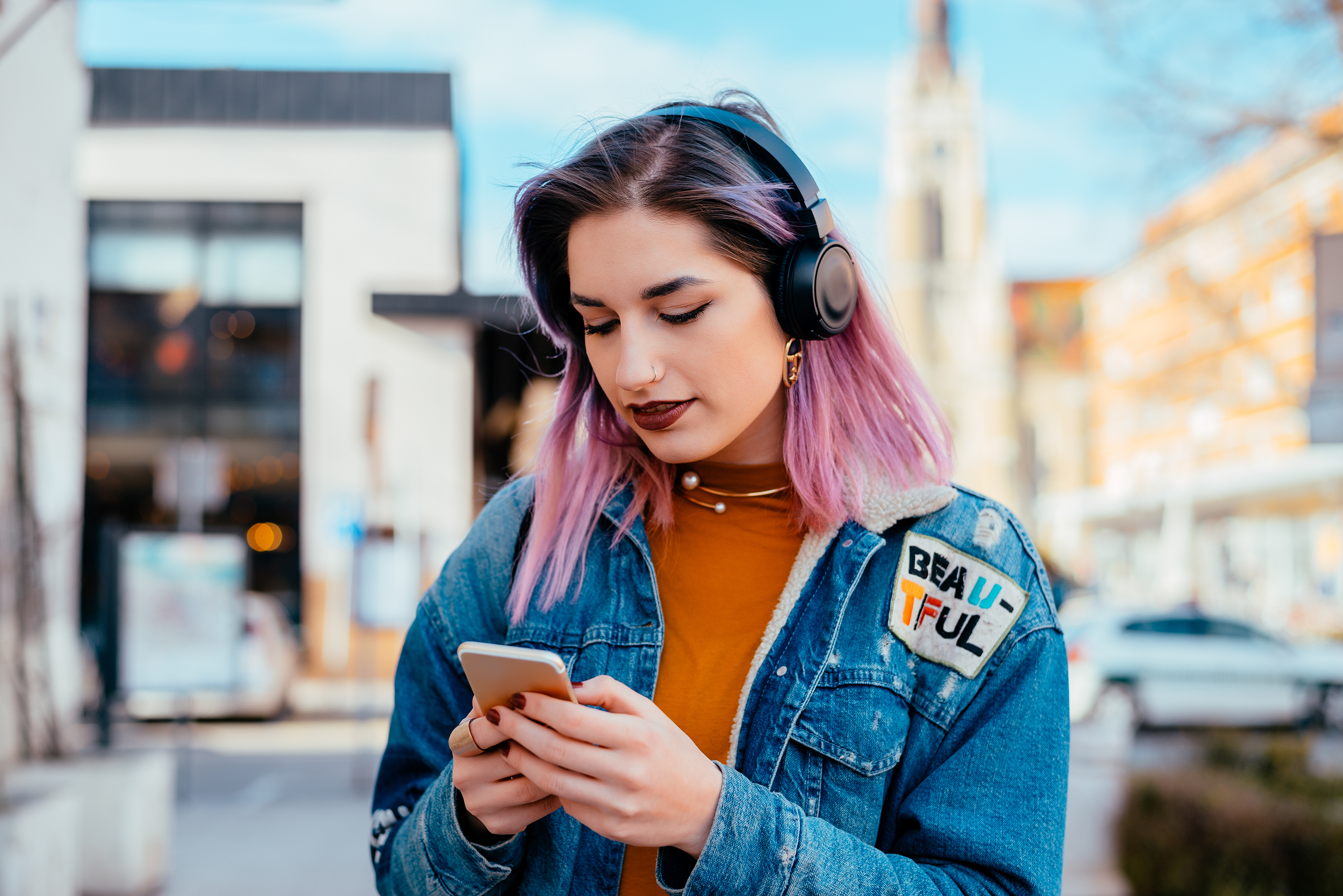 Women on phone wearing headphones