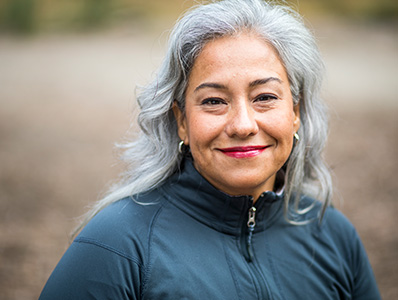 Woman smiling in blue jacket