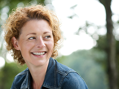 Woman at a park smiling