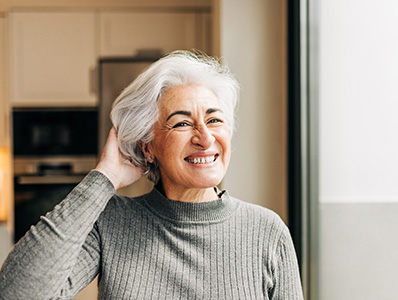 Woman in her kitchen smiling