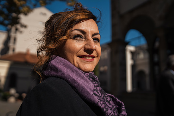 Woman with purple scarf in a city