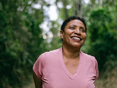 Woman with pink top going for a bushwalk