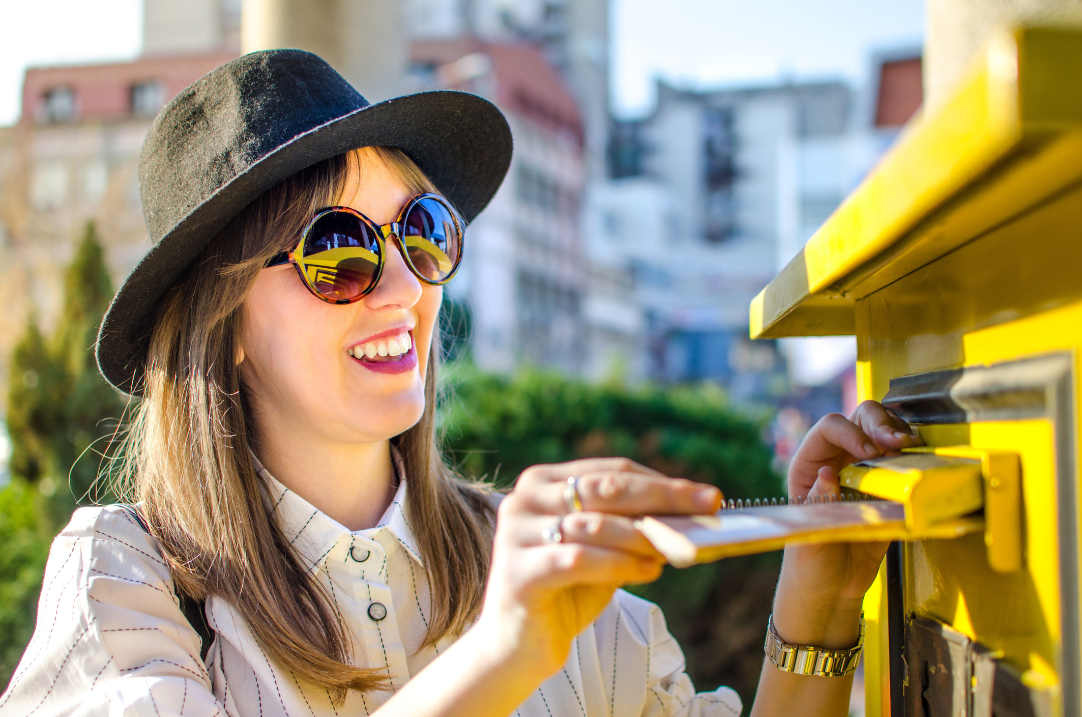 Woman posting a letter