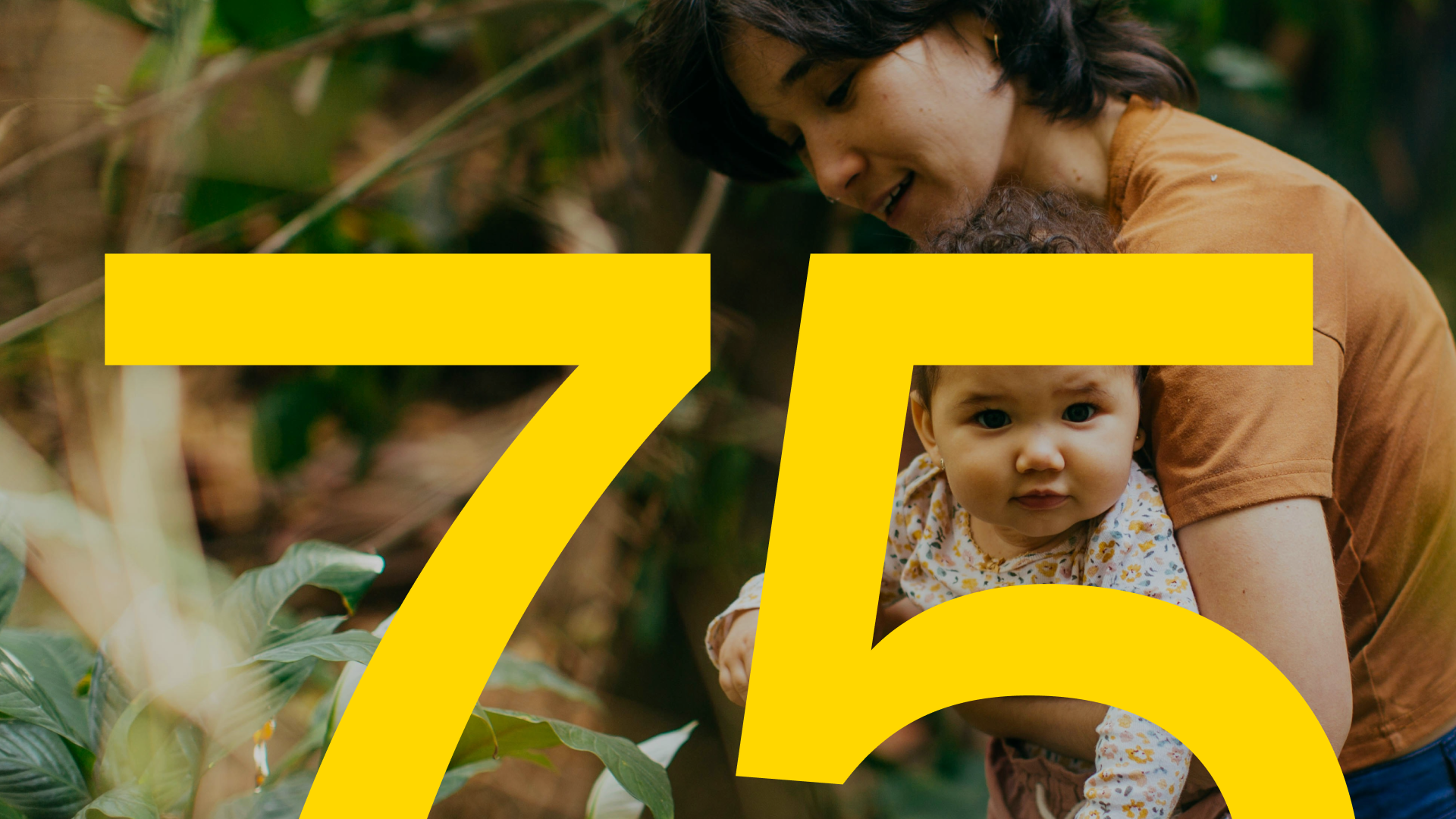 Wellbeing photo of parent and child with Business For 75 overlay