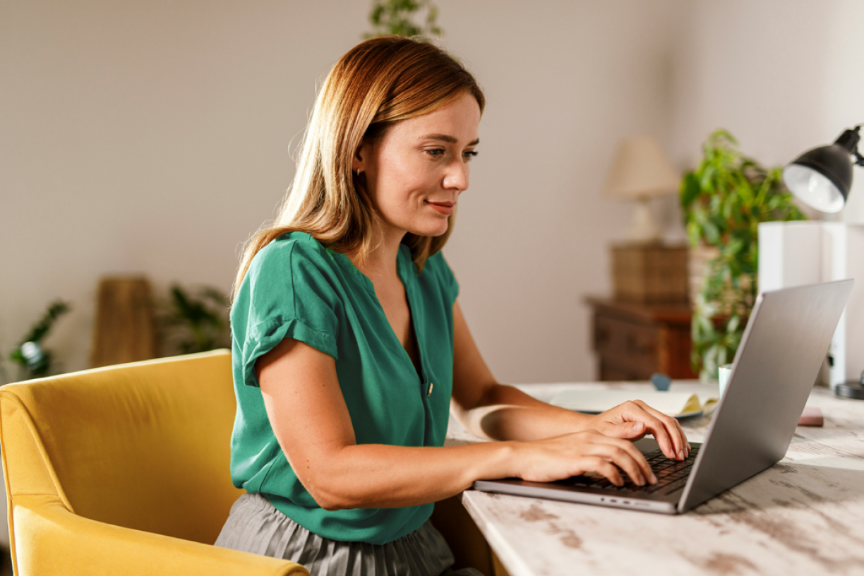 Woman typing on laptop