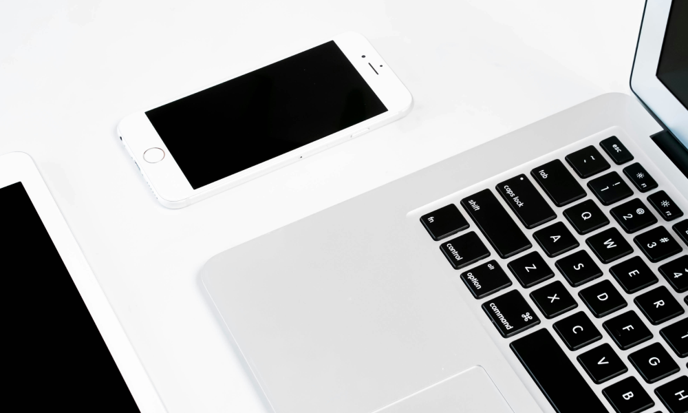 laptop and phone on a desk