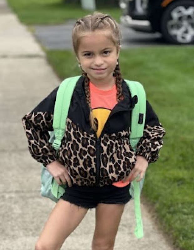 Girl with a green backpack