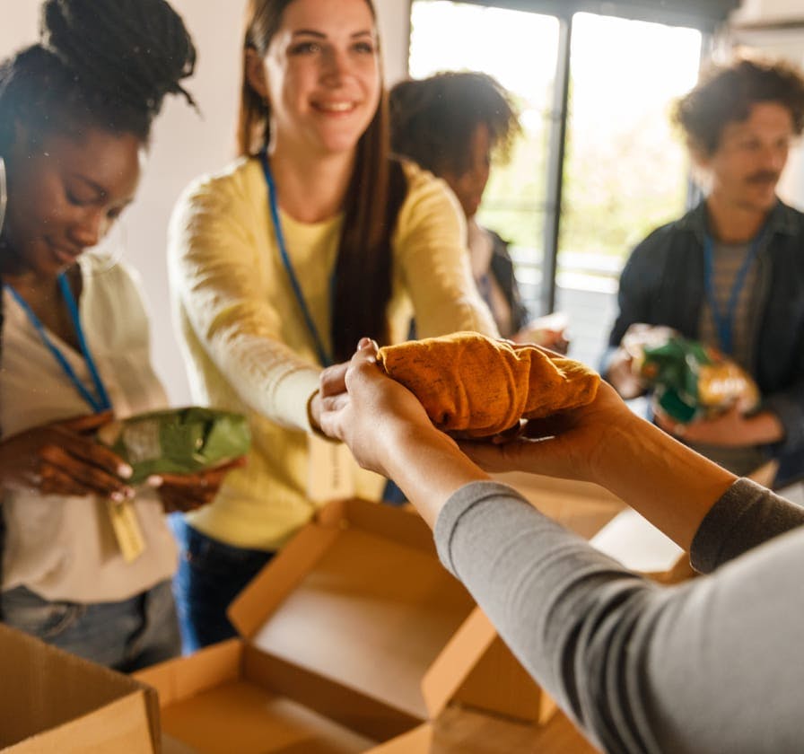 Woman passing someone a rag