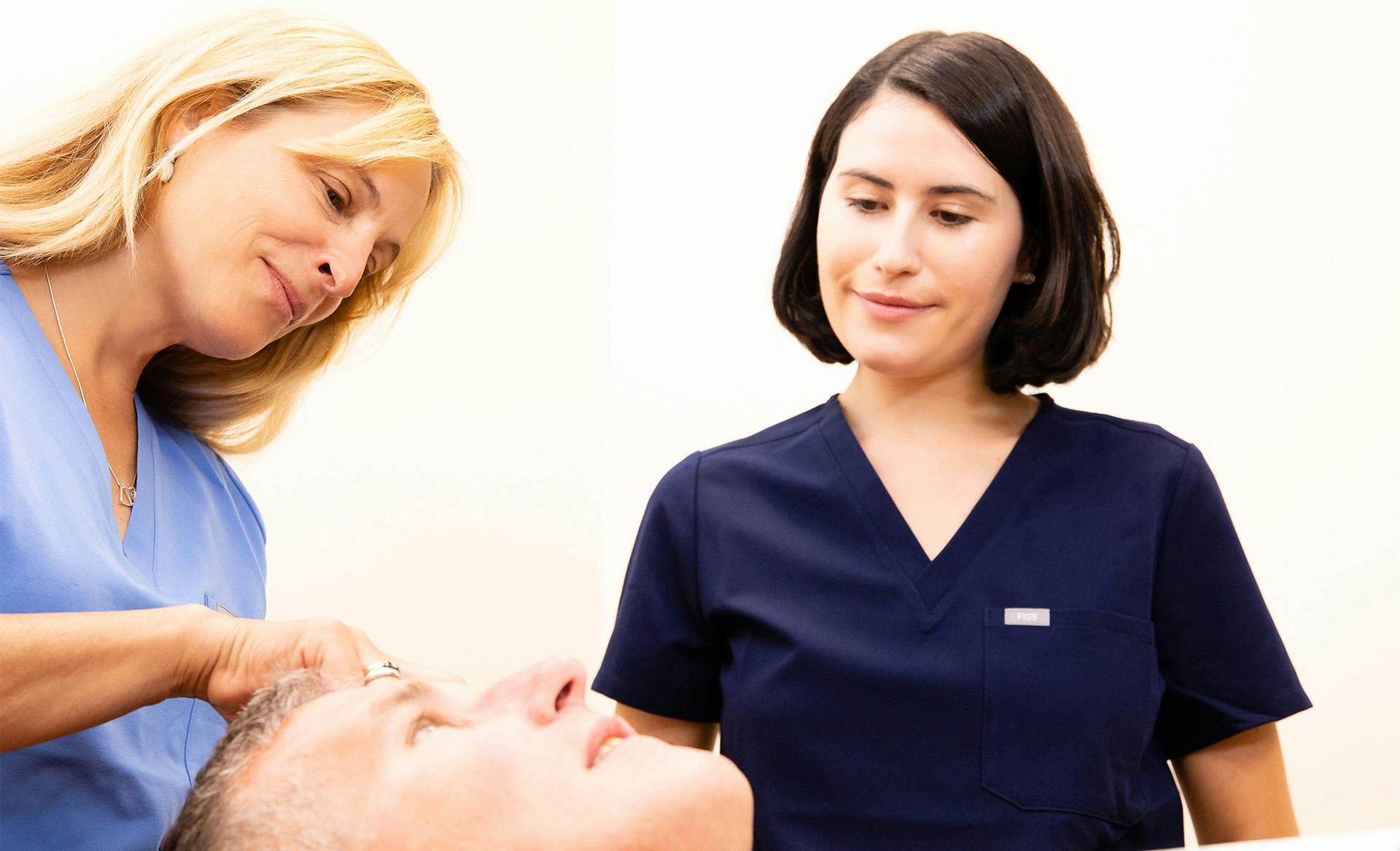 two doctors working with patients