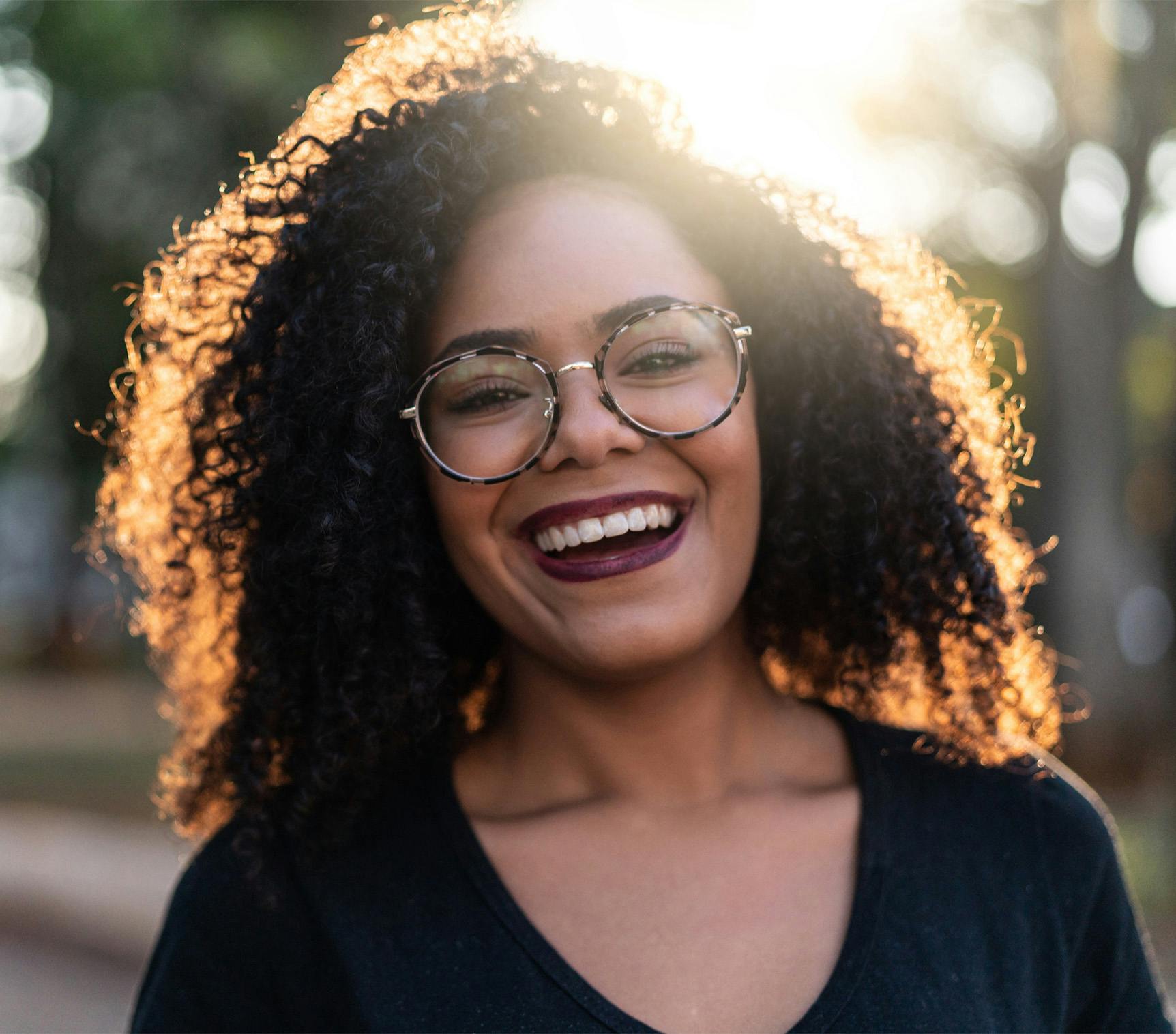 Woman with glasses smiling
