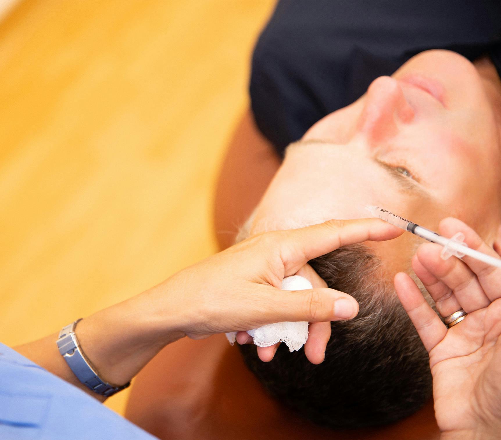 man getting facial injection