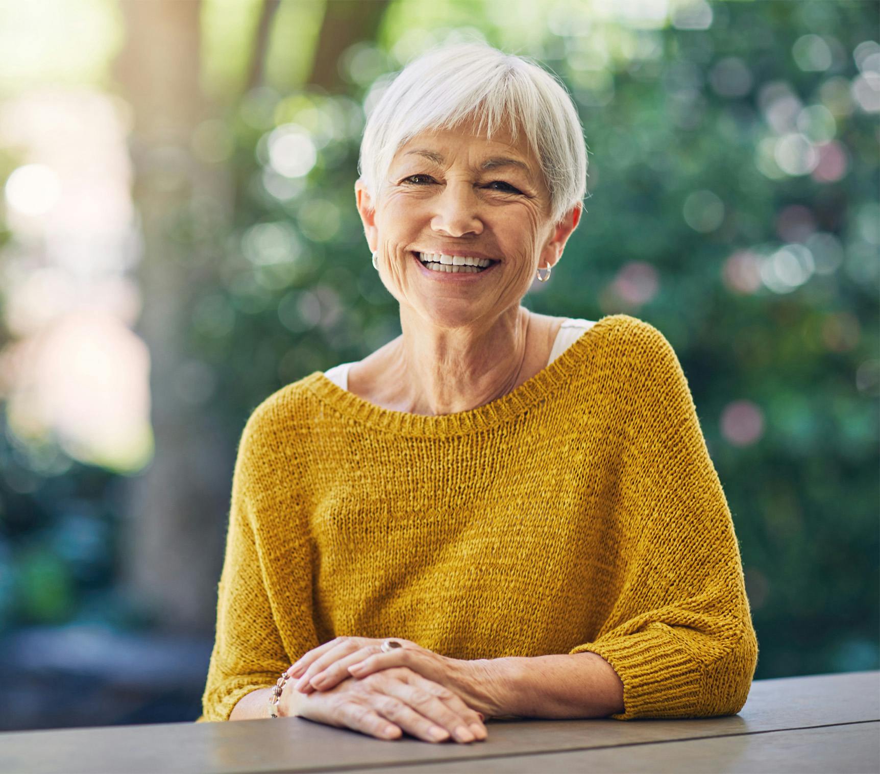 older woman in yellow shirt