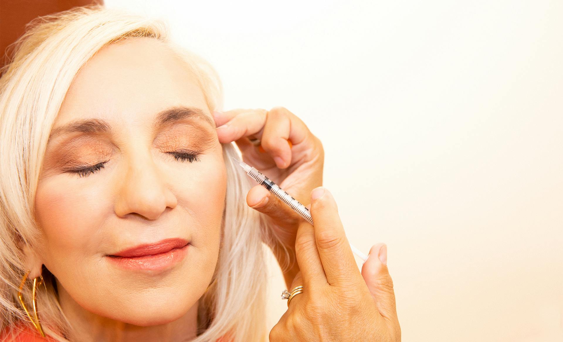 woman getting facial injection