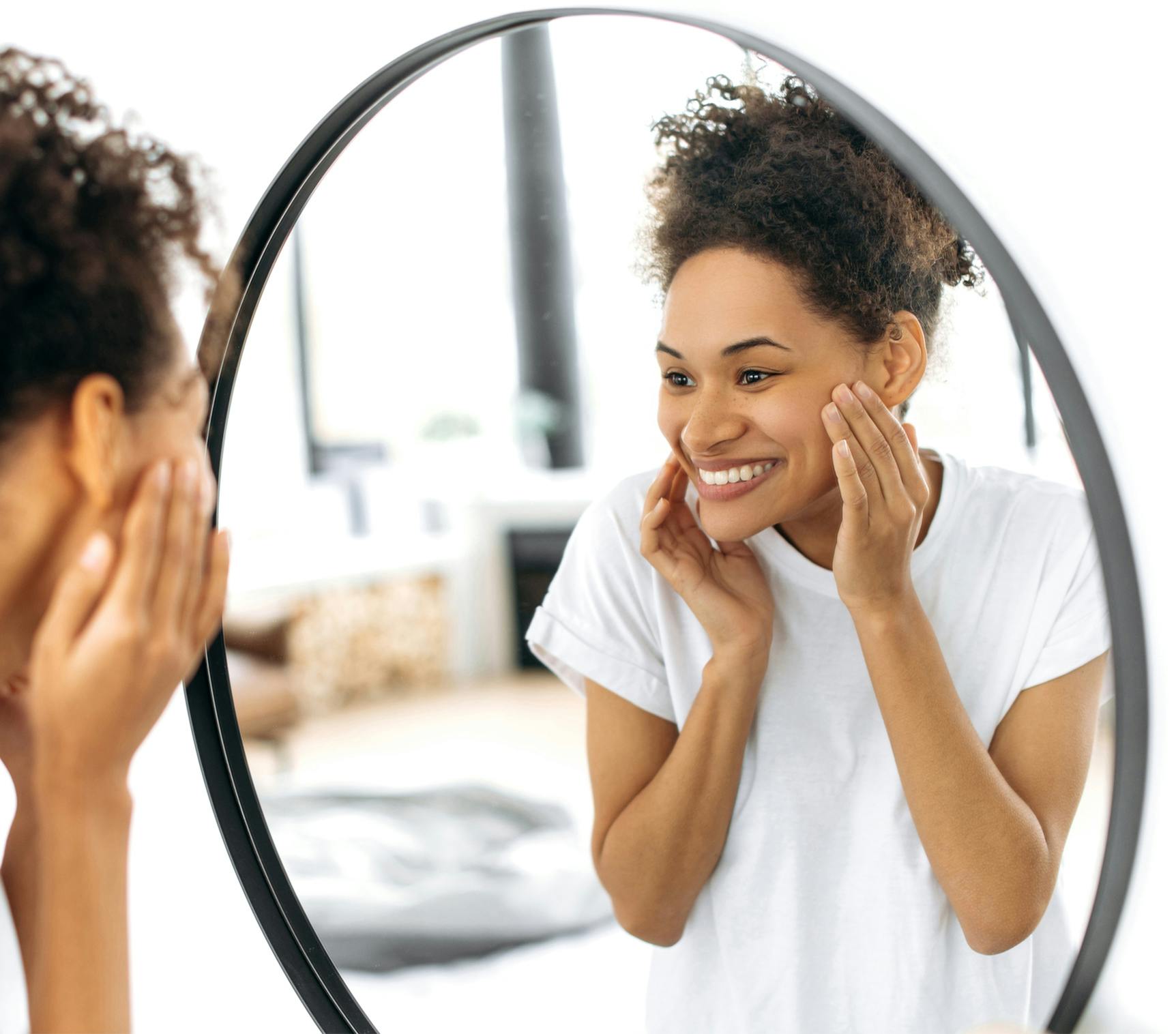 woman looking in the mirror