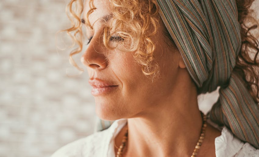 woman closing her eyes